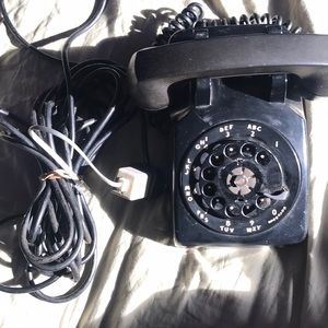 old fashioned dial phone with land line connector